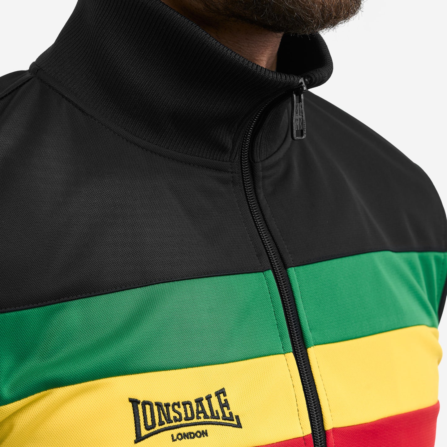 LONSDALE Trainingsjacke - Track Jacket mit farblich abgesetzten Jamaika-Panel (schwarz - gruen,gelb,rot))